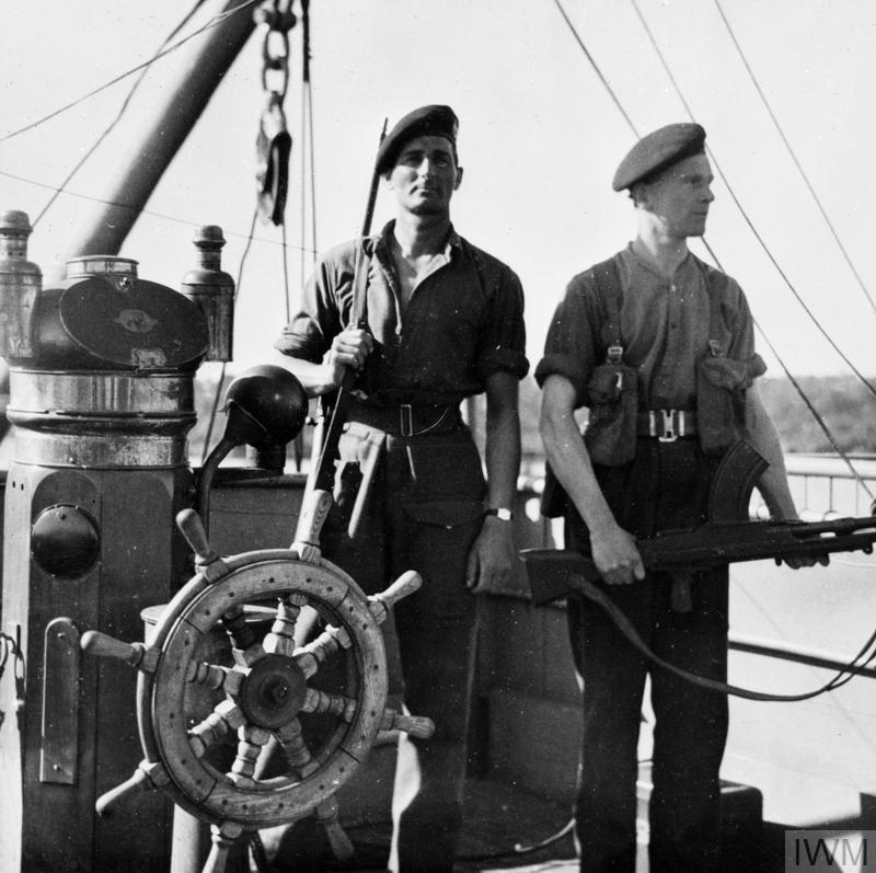 ROYAL MARINES GUARD GERMAN MERCHANT SHIPS. MAY 1945, KIEL, GERMANY. ROYAL MARINE GUARDS TOOK