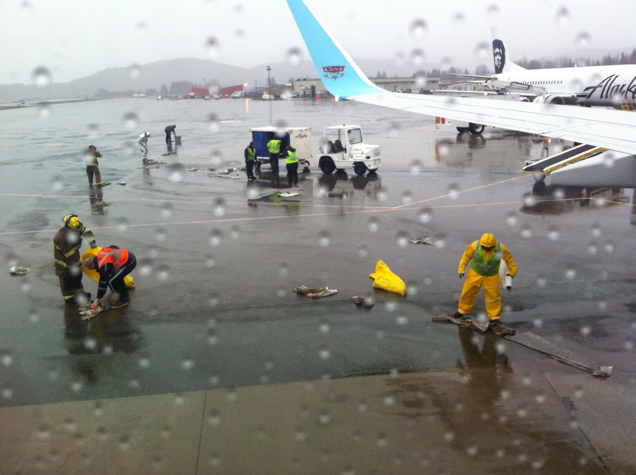 Cleaning small fuel spill at Juneau airport requires group work