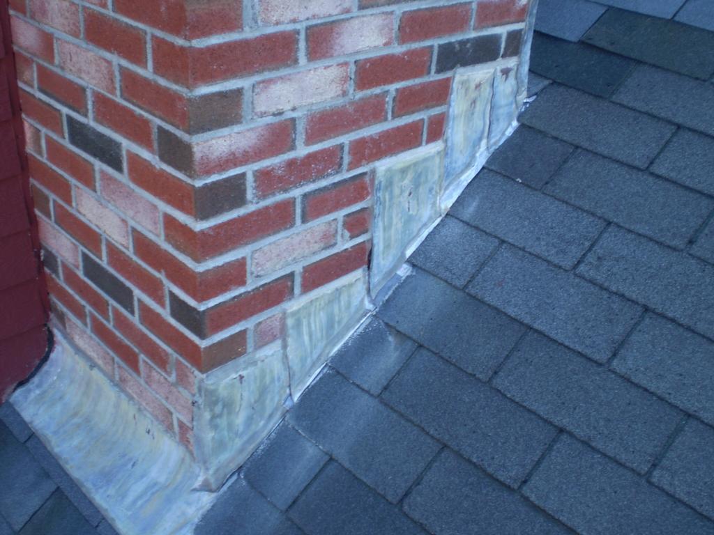 The finish chimney, lead flashing cut even w/ the roof, over the