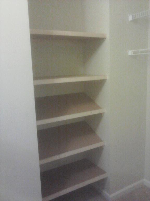 Custom closet shelves and shoe rack from General Repairs LLC a home repair company in