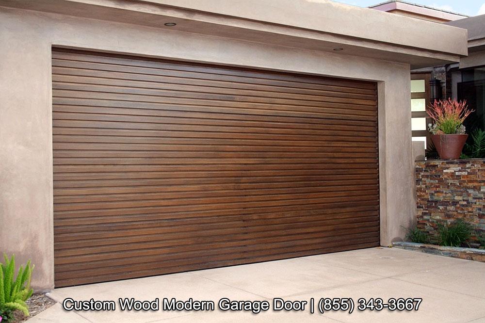 Custom designed modern wood garage doors with horizontal, staggered wood slat design. Sectional