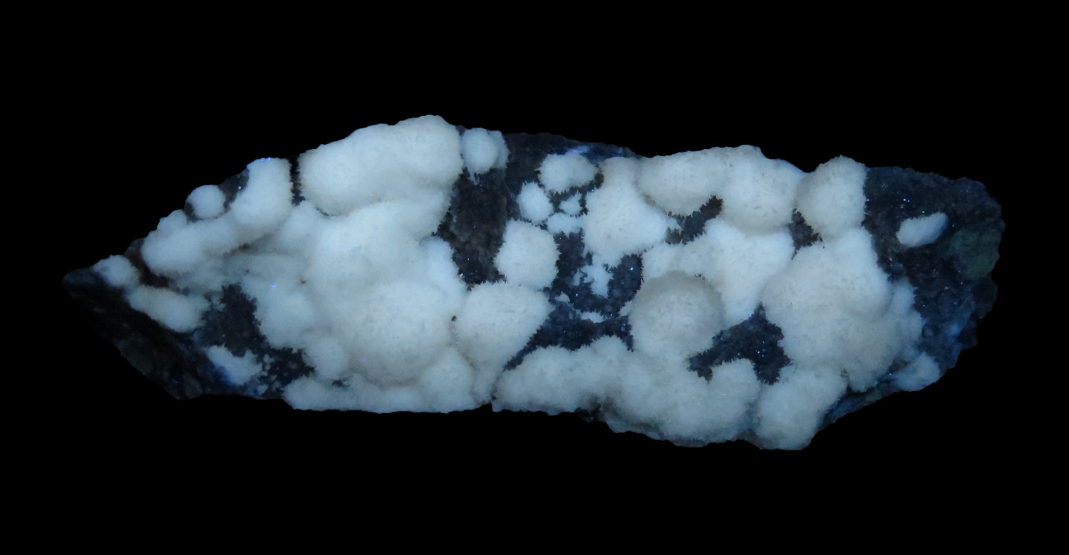 Strontianite (fluorescent) on Calcite (Reynolds Coll.) National
