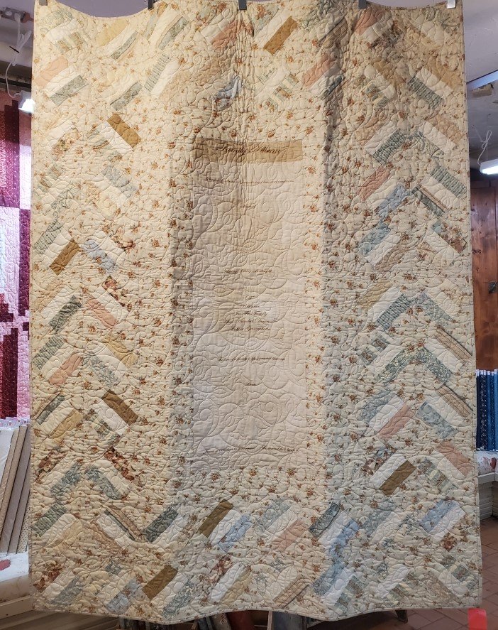 Family Album quiltFeatures a center panel where family tree history