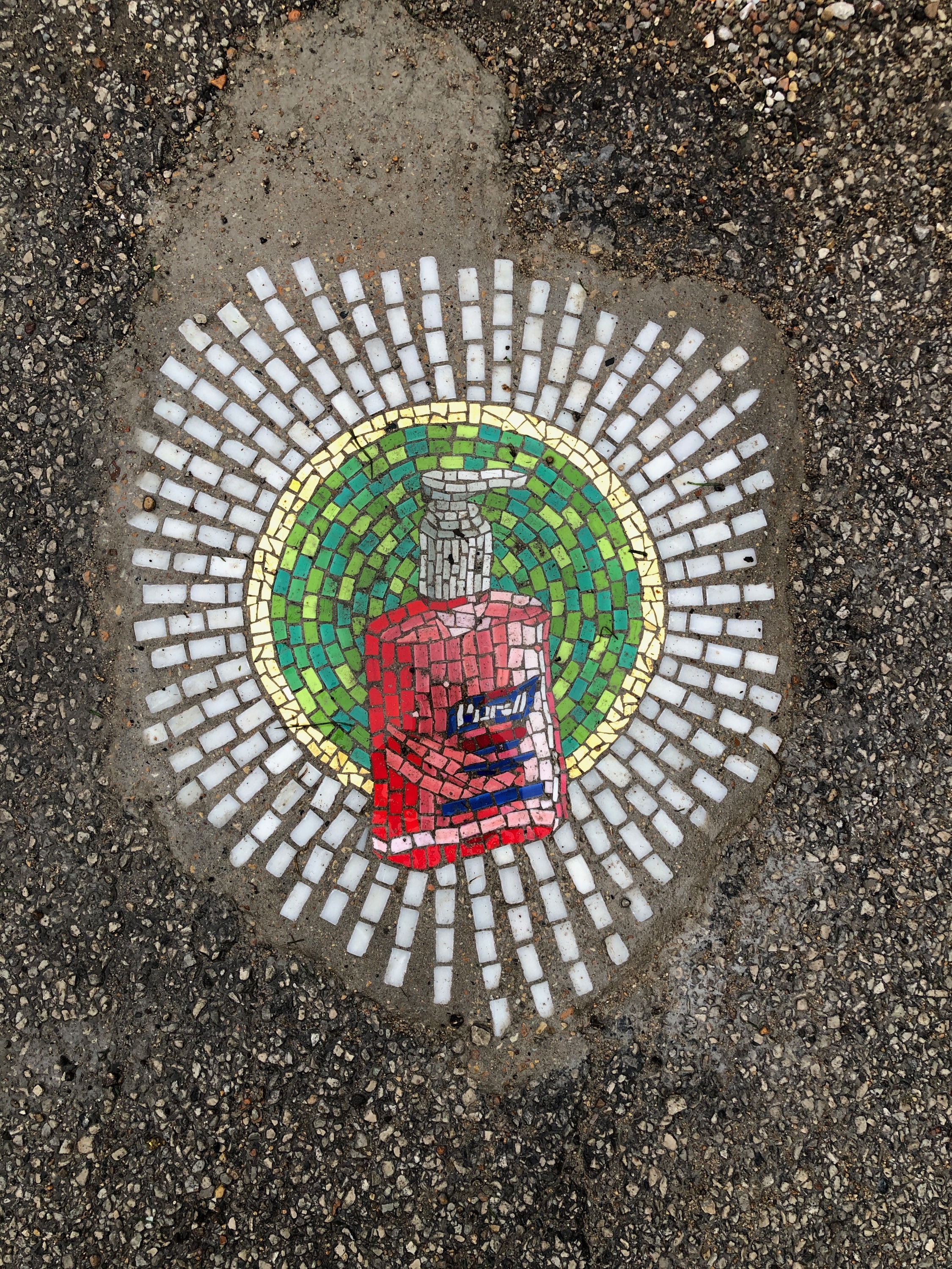 This Chicago artist is filling potholes with stunning mosaics of toilet