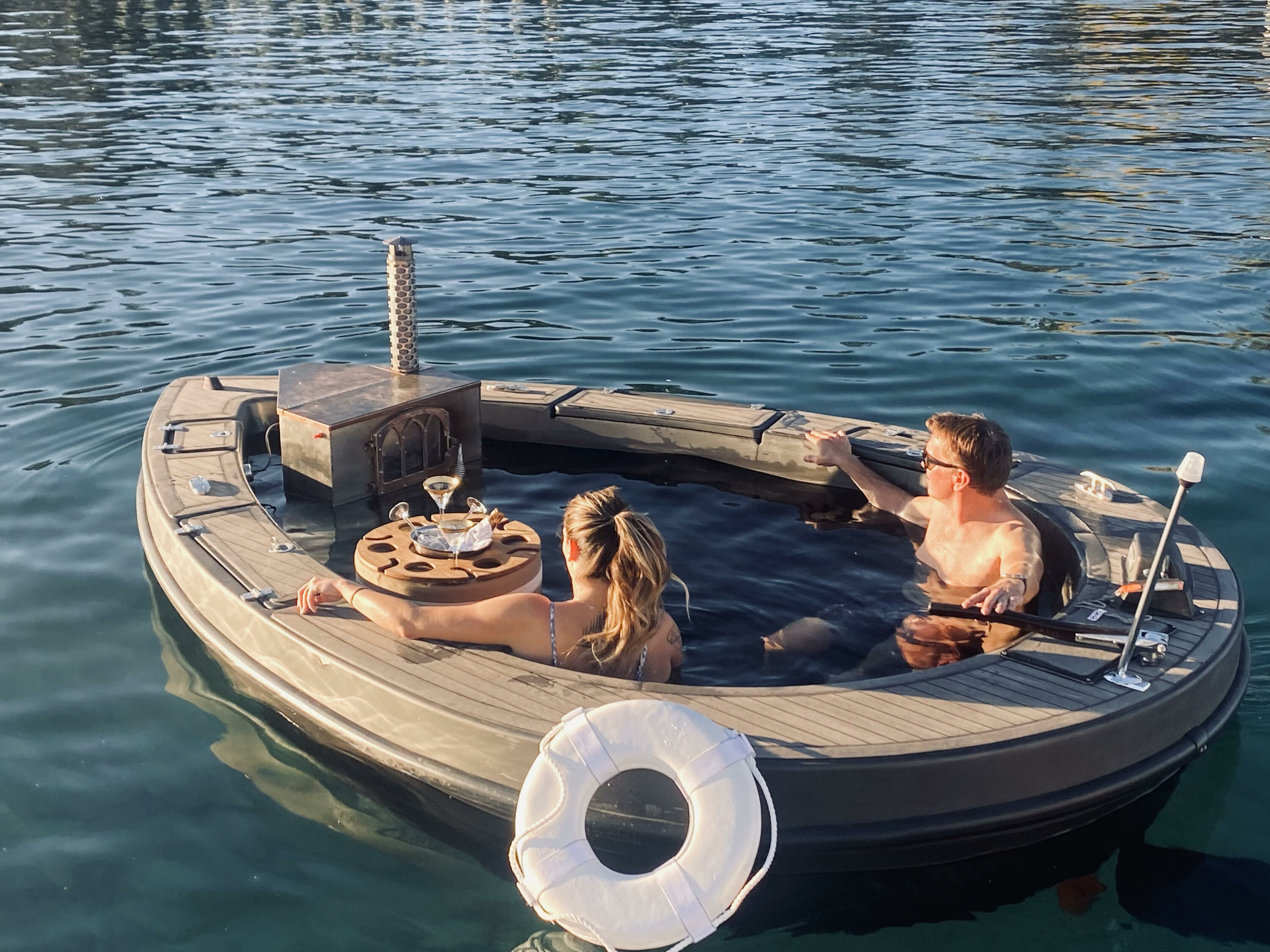 You can cruise down the river in a hot tub boat this winter