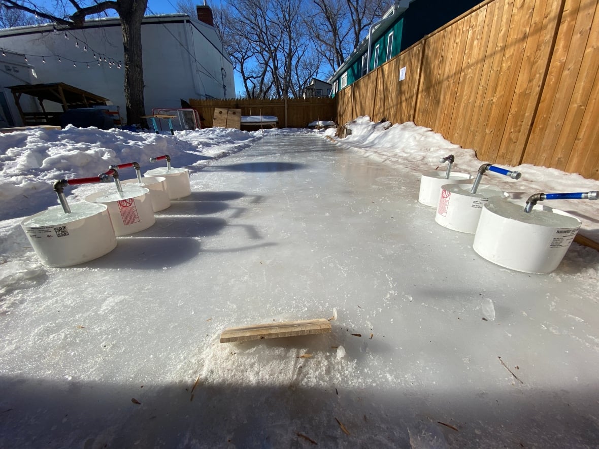 Sask. business builds backyard curling rink to help 'embrace winter a