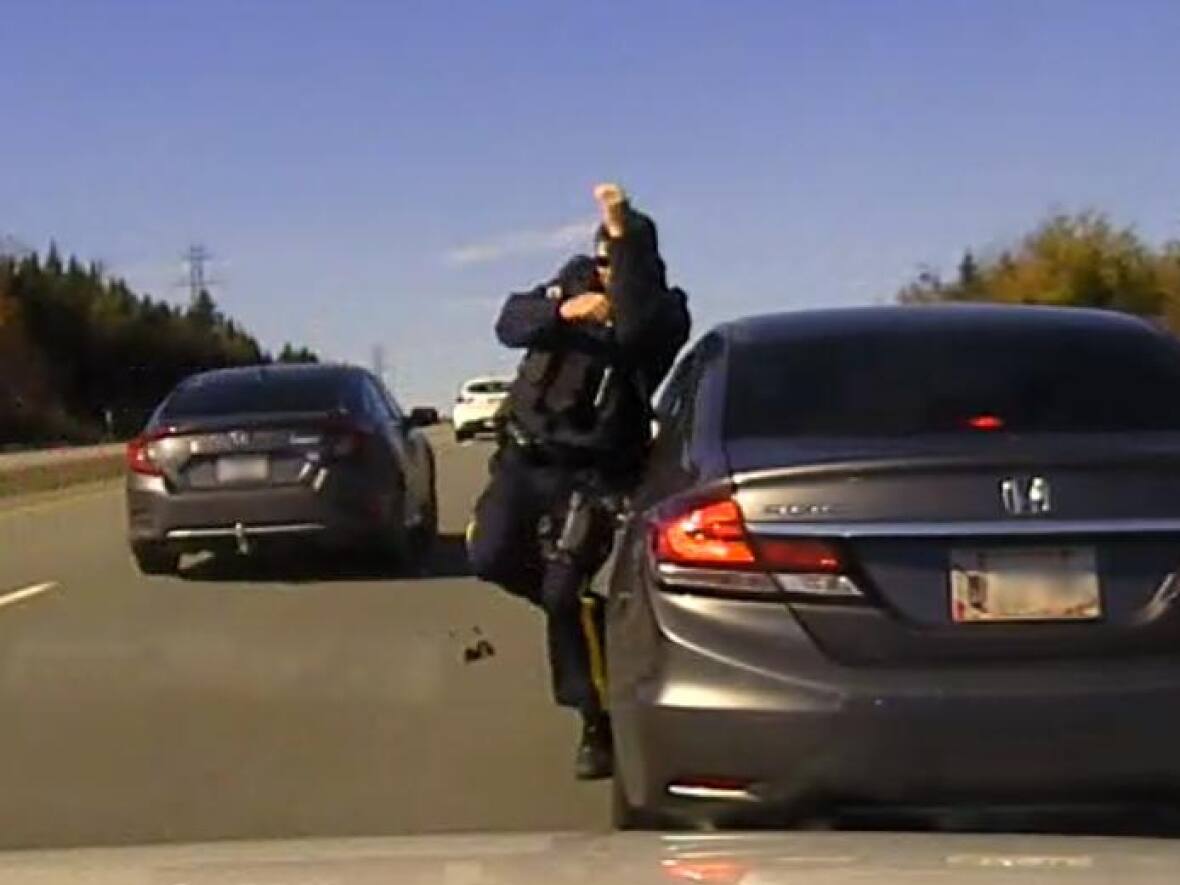 Police car hit, officer nearly struck by passing car during traffic stop