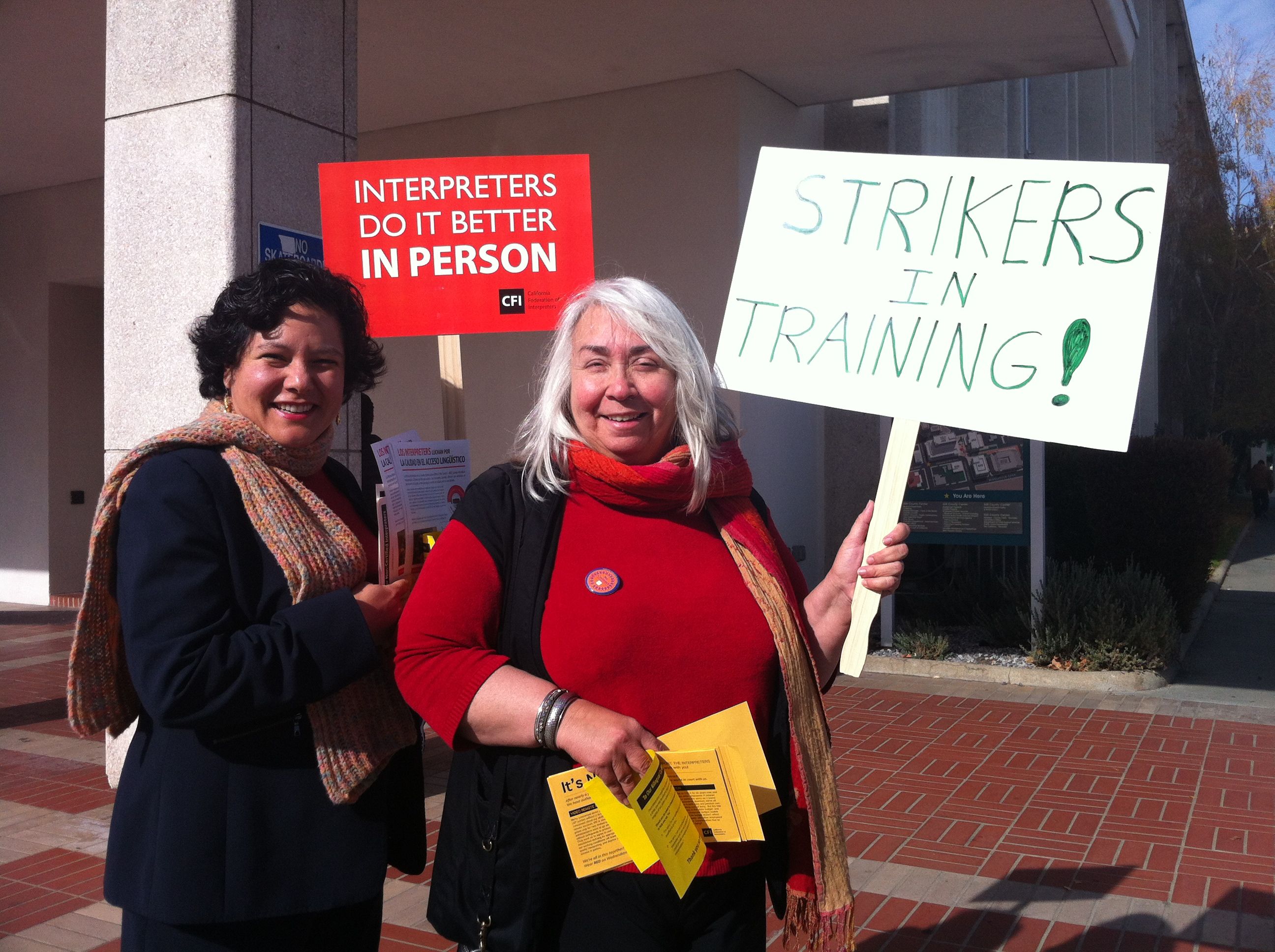 r2-interpreters-don-t-let-rain-dampen-their-resolve-continue-picketing