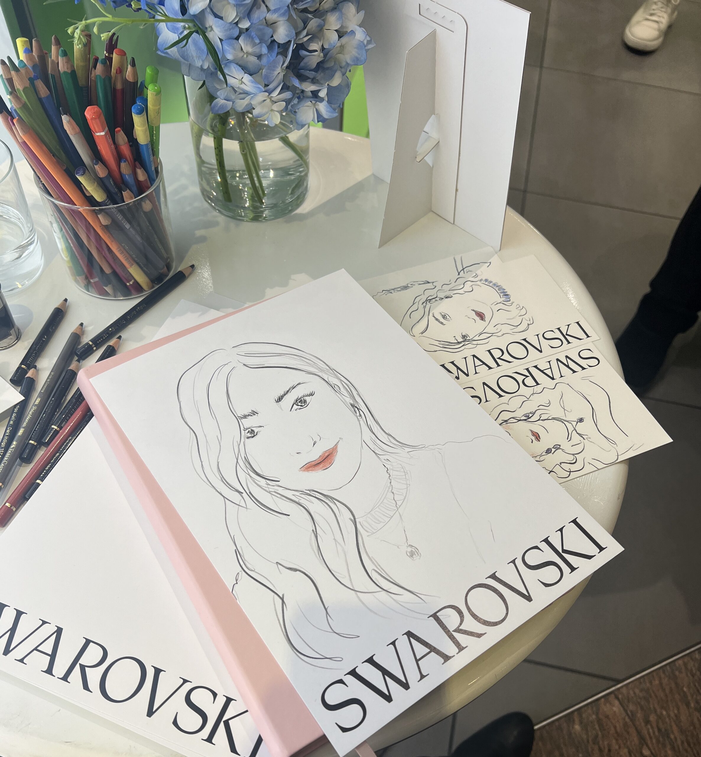 portrait illustrations by live illustrator and portrait artist for swarovski in manchester