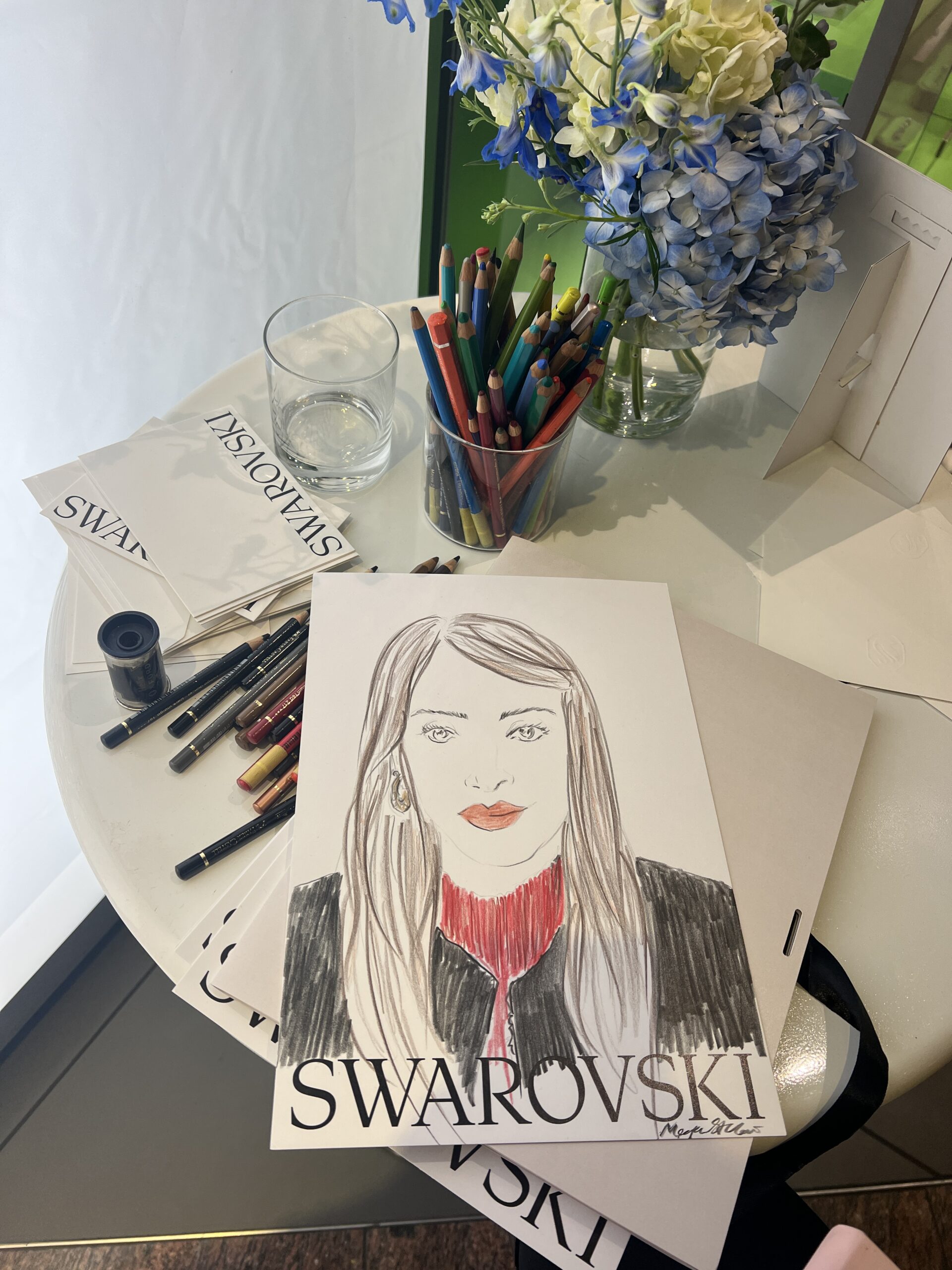 portrait illustrations by live illustrator and portrait artist for swarovski in manchester