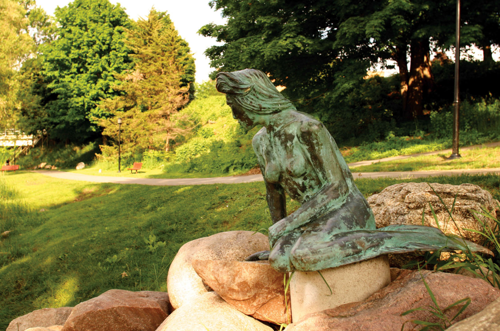 The Little Mermaid statue on Flat River, Greenville Michigan