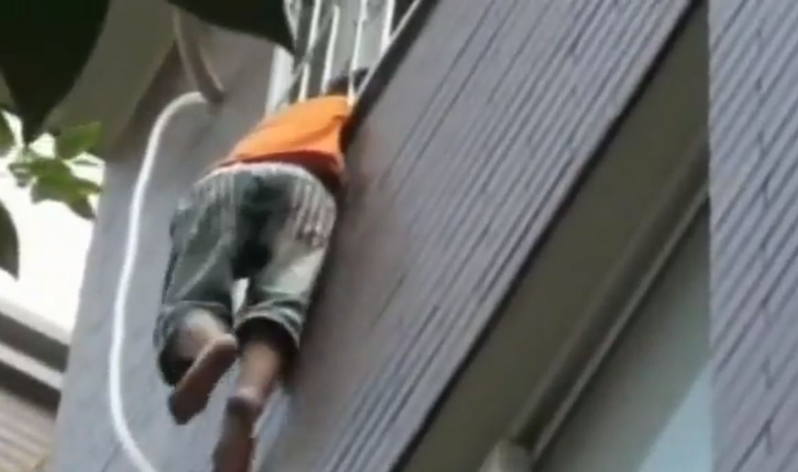 Boy, 5, rescued dangling from fourth floor balcony in China Metro News