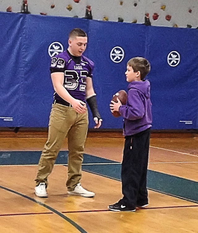 Kahoks football team lends a hand at Science of the Super Bowl event