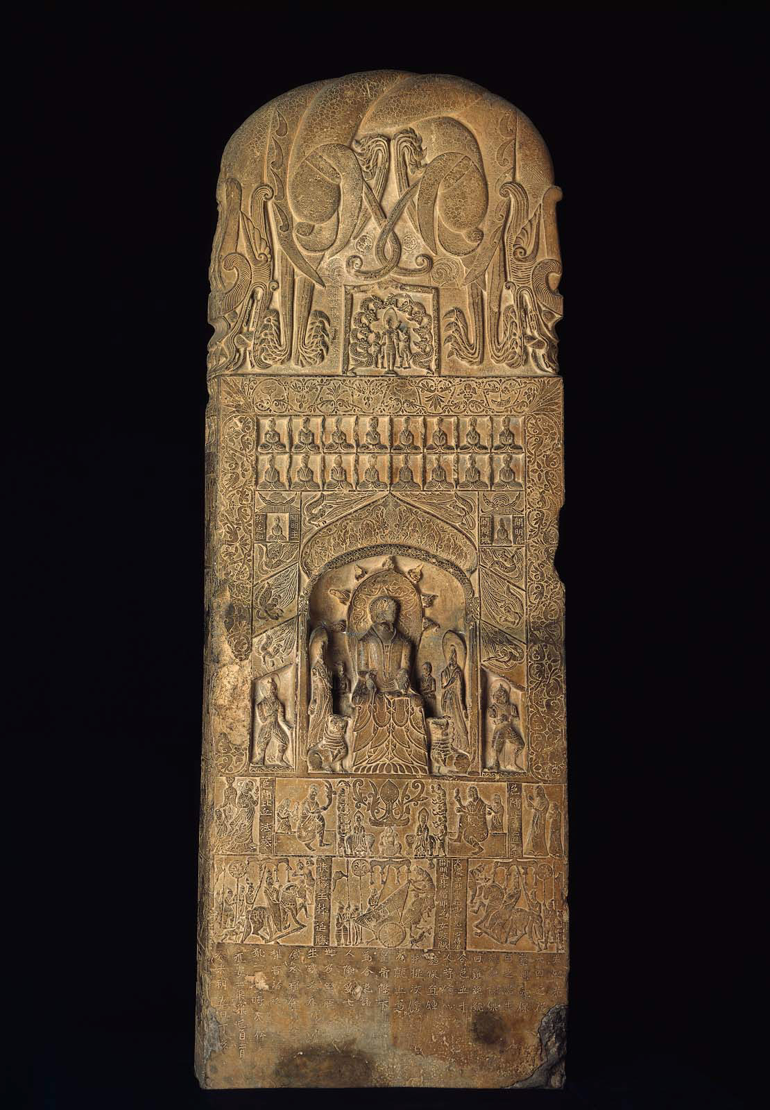 Buddhist votive stele with carved Buddhist figures and inscriptions