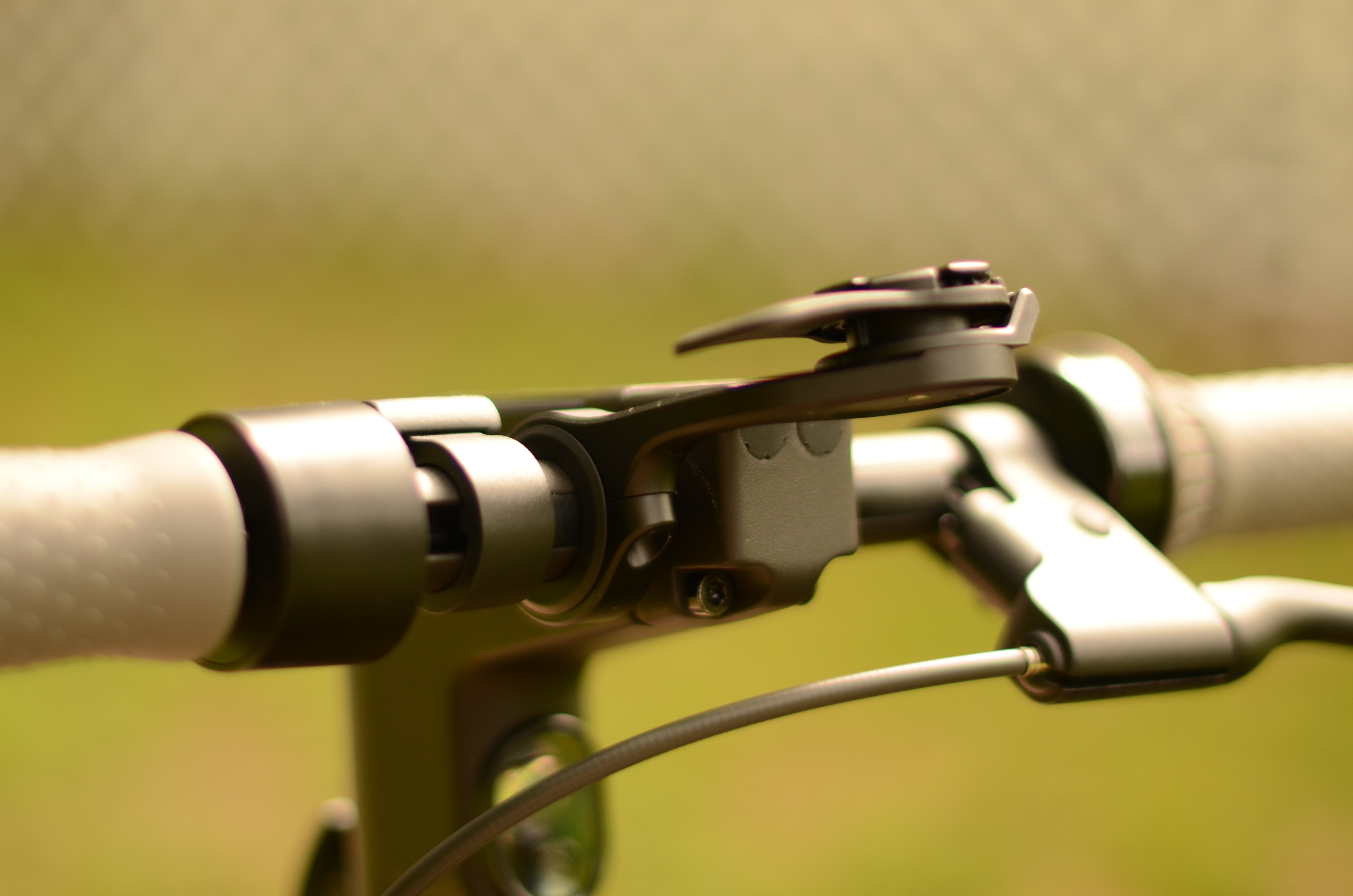 Quad Lock securely attaches your iPhone to bicycles, escooters