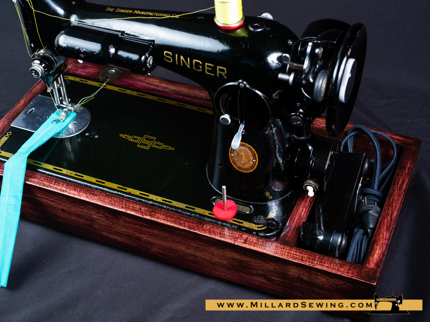 Base for full size sewing machine. Millard Sewing Center