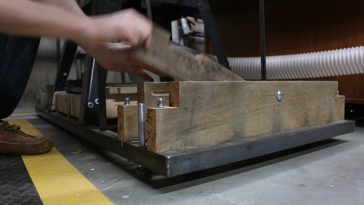 How to make retractable wheels for a heavy table saw by Andrew Reuter