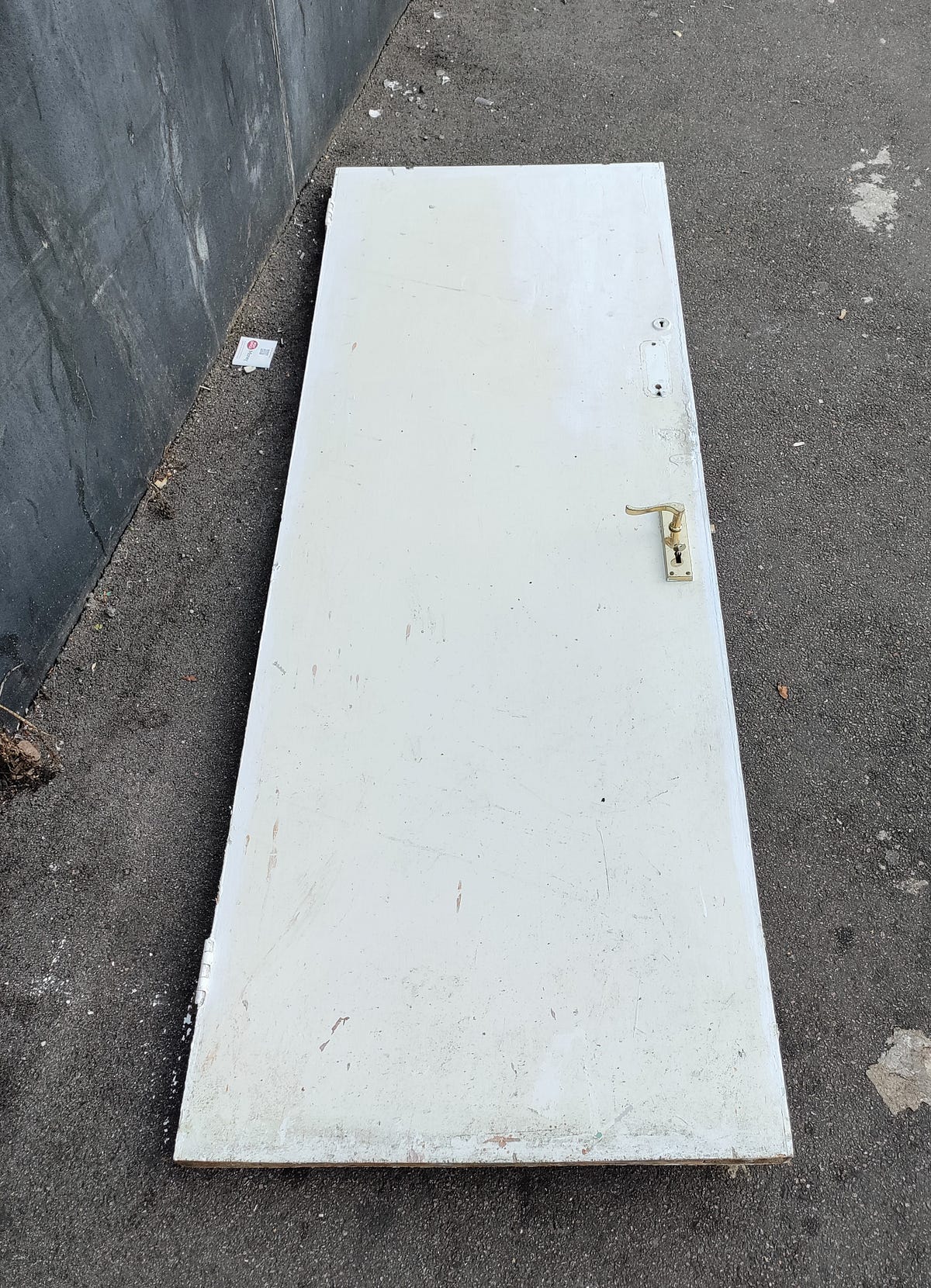 A door in the floor. Writing prompts from street photography by Rose