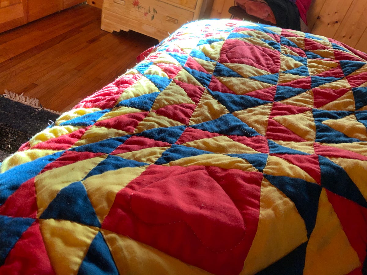 Pulling the covers over my head. Snug under the flannel, the wool, the