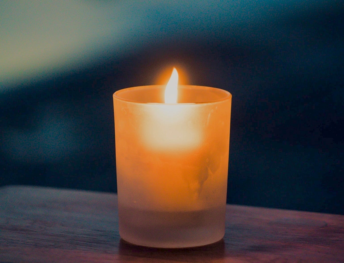 A Candle Lit. A candle lit in its peaceful moment. by Jessica