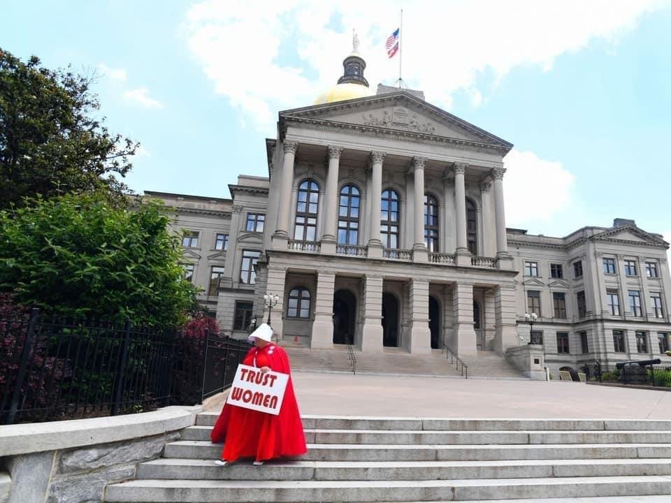 How to Organize a Red Cloak Protest by Vigil for Democracy Medium