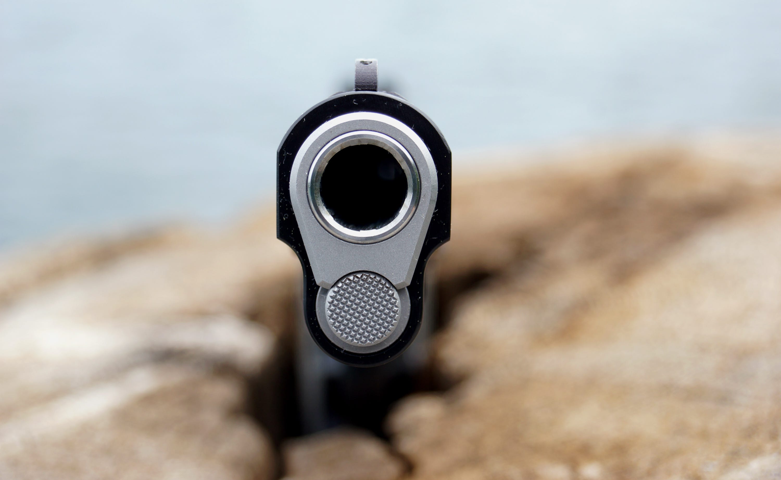 Perspective at the end of a gun barrel by Brandon Trew On my mind