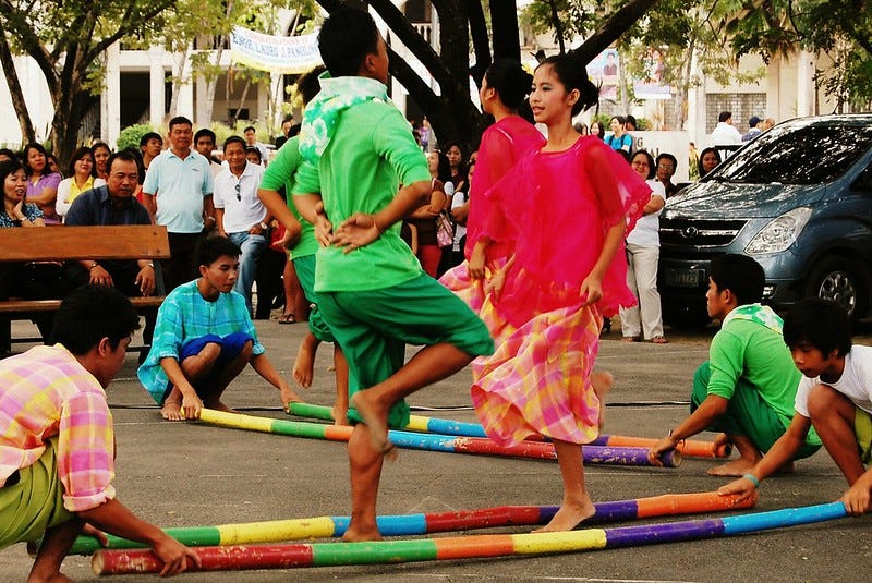 Tinikling Dodging bamboo traps while performing the Filipino folk