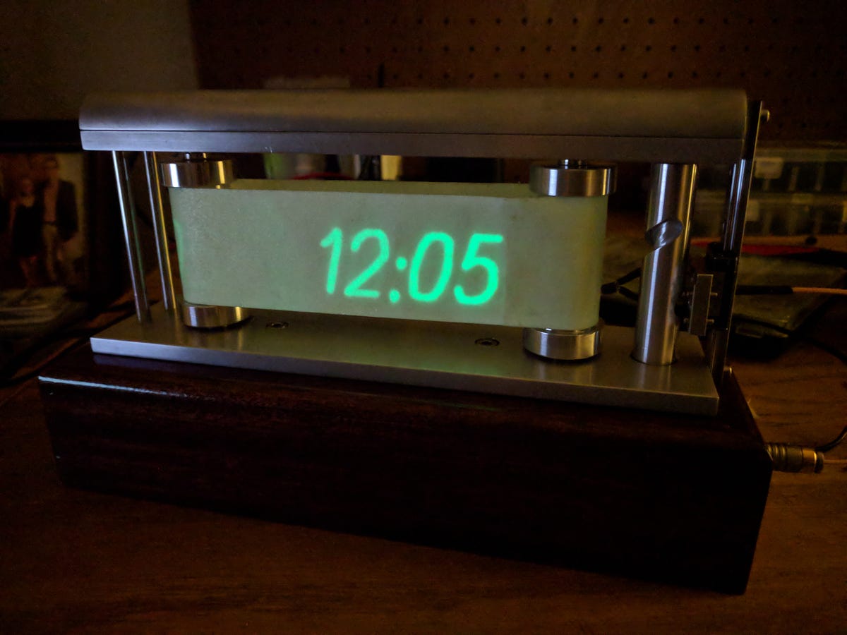 This Clock Plots the Time in UV Letters on GlowintheDark Film by