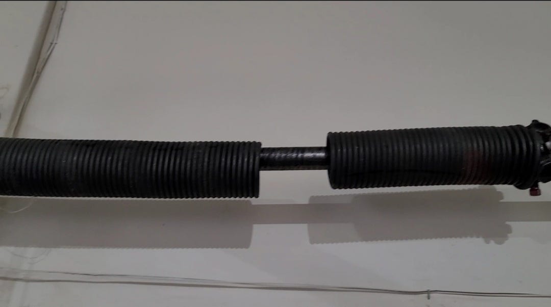 This is what a broken Torsion Spring looks like! https