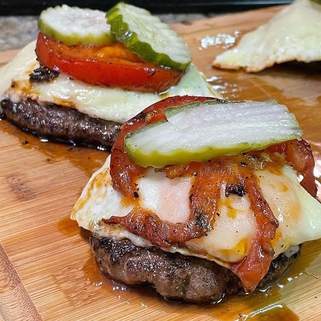 Leftover burger patties from yesterday cooked in cast iron, topped off
