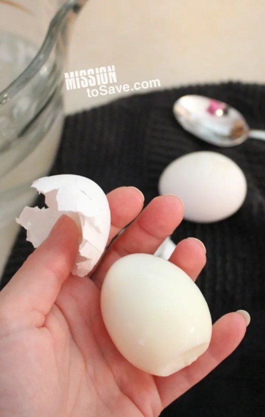 peeling a hard boiled egg baked in the oven