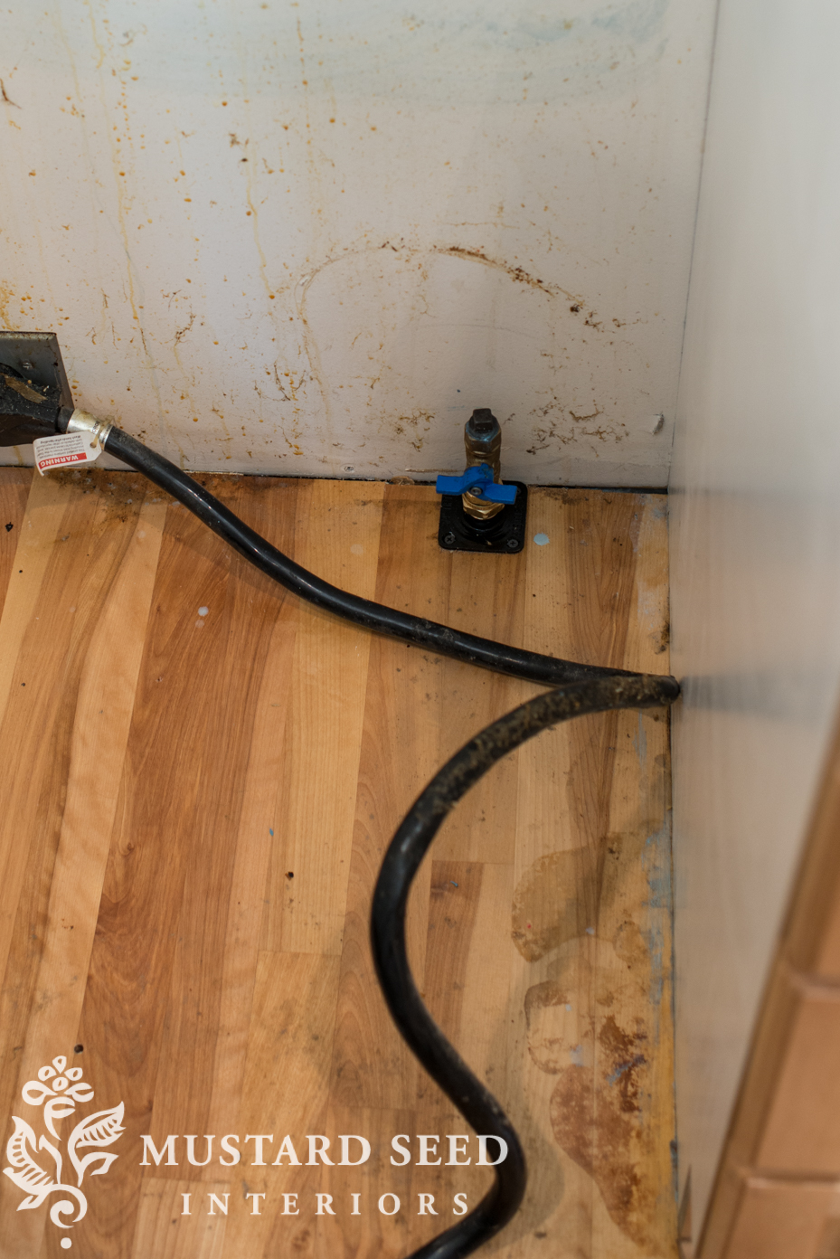 How To Safely Clean Behind Your Kitchen Stove