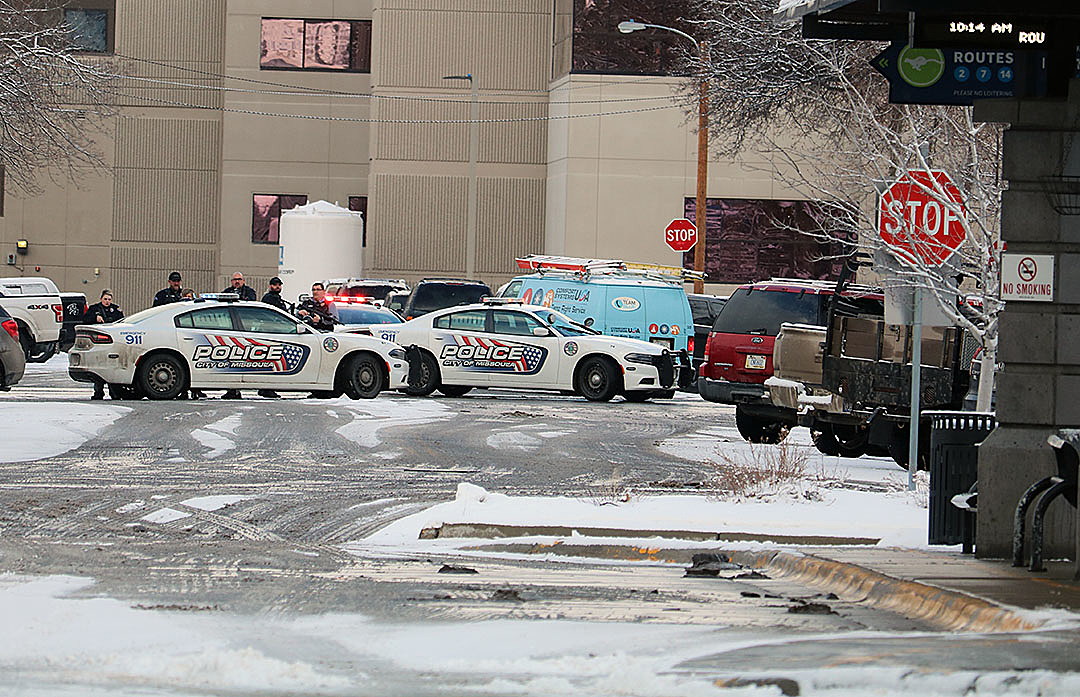 Gunman fires on police; lockdown disrupts government as officers