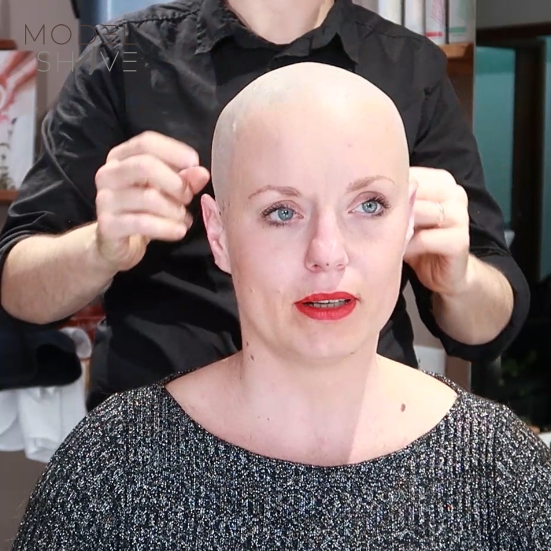 Woman with long hair makes an appointment to get her head shaved bald