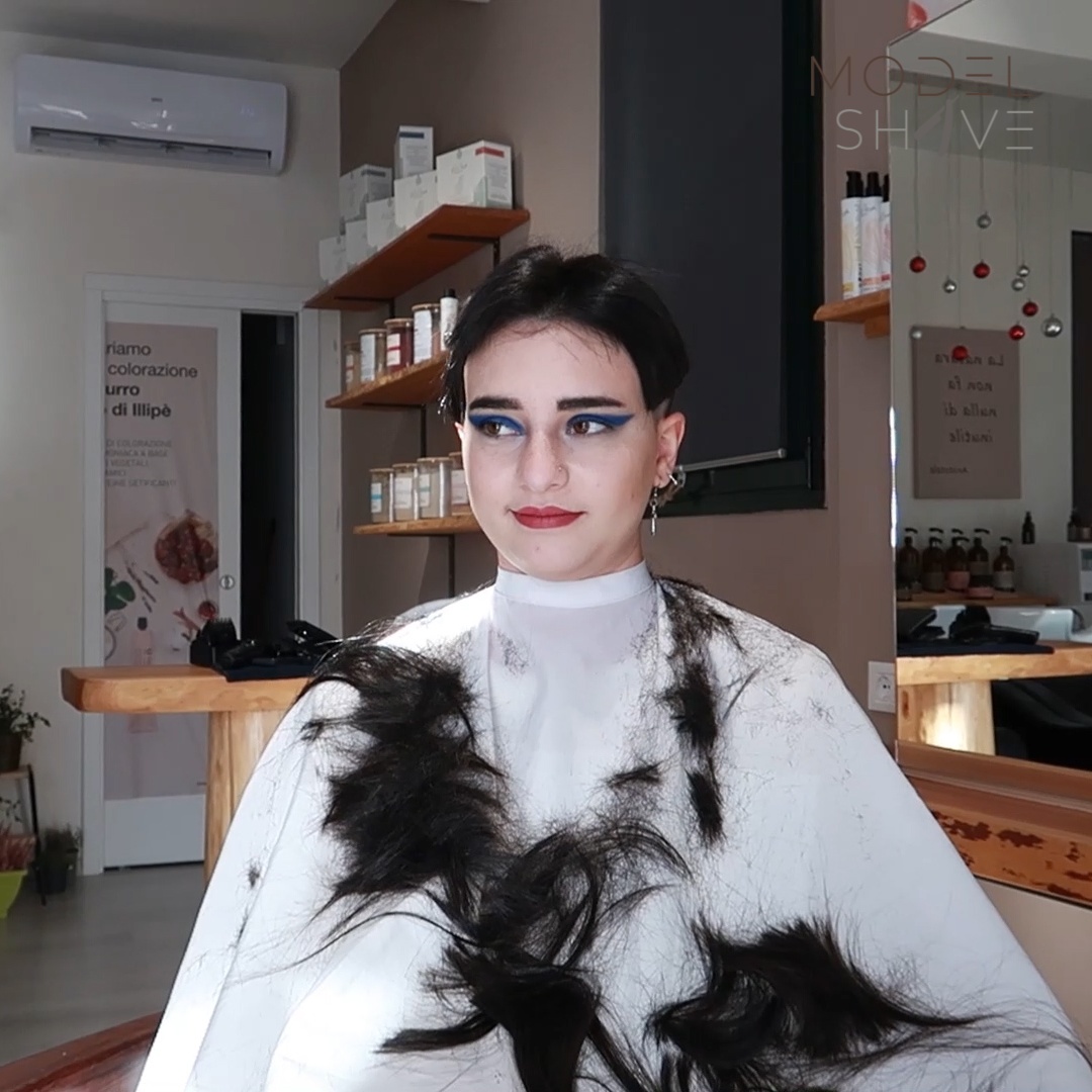 Girl with long silky black hair gets a smooth bald head. Model Shave