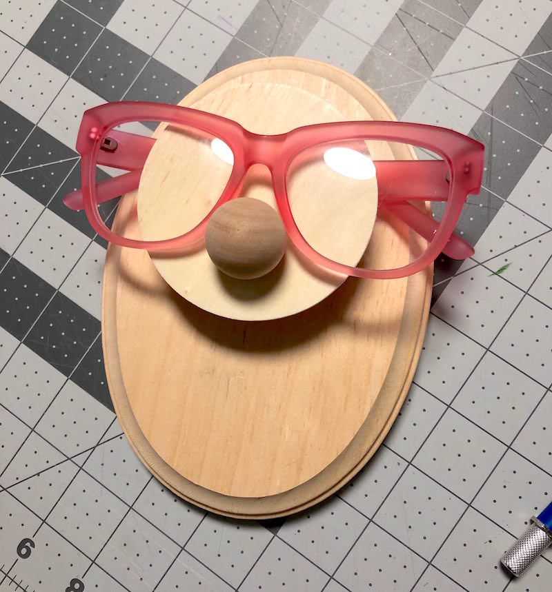 DIY Glasses Holder Display with Fun Faces Mod Podge Rocks