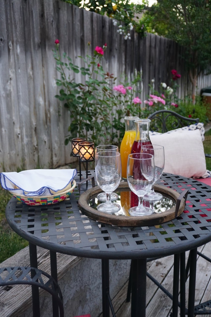 A Festive Blue And Rustic Setting For Small Outdoor Gathering