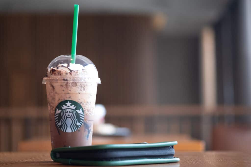 Bangkok, Thailand - January 5, 2020 : Glass of Starbuck coffee Frappuccino blended beverages with a new years gift exclusive for member of Gold Level