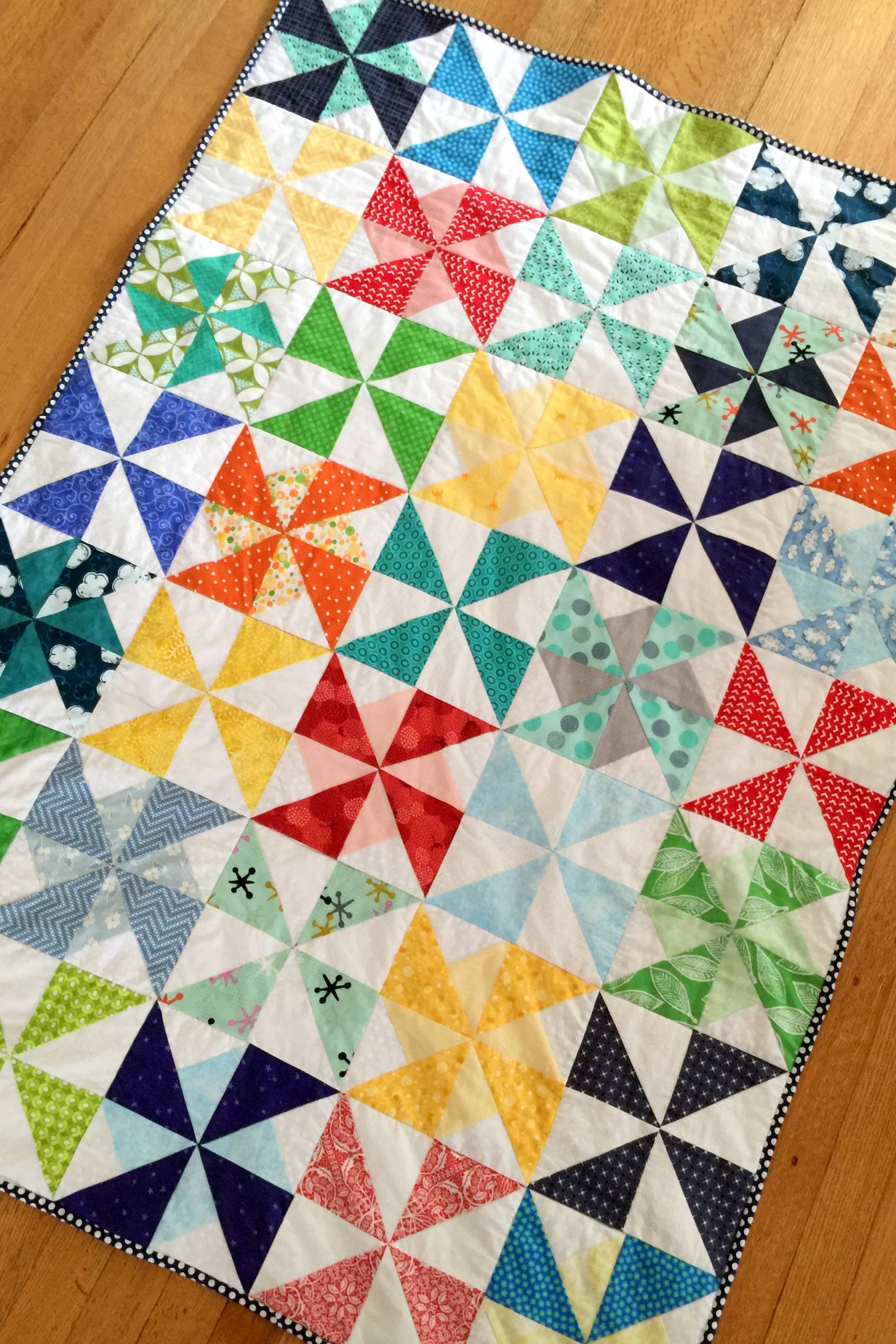 Pinwheel/ Windmill Crib Toddler Quilt in Primary Colors on Mostly Sewing