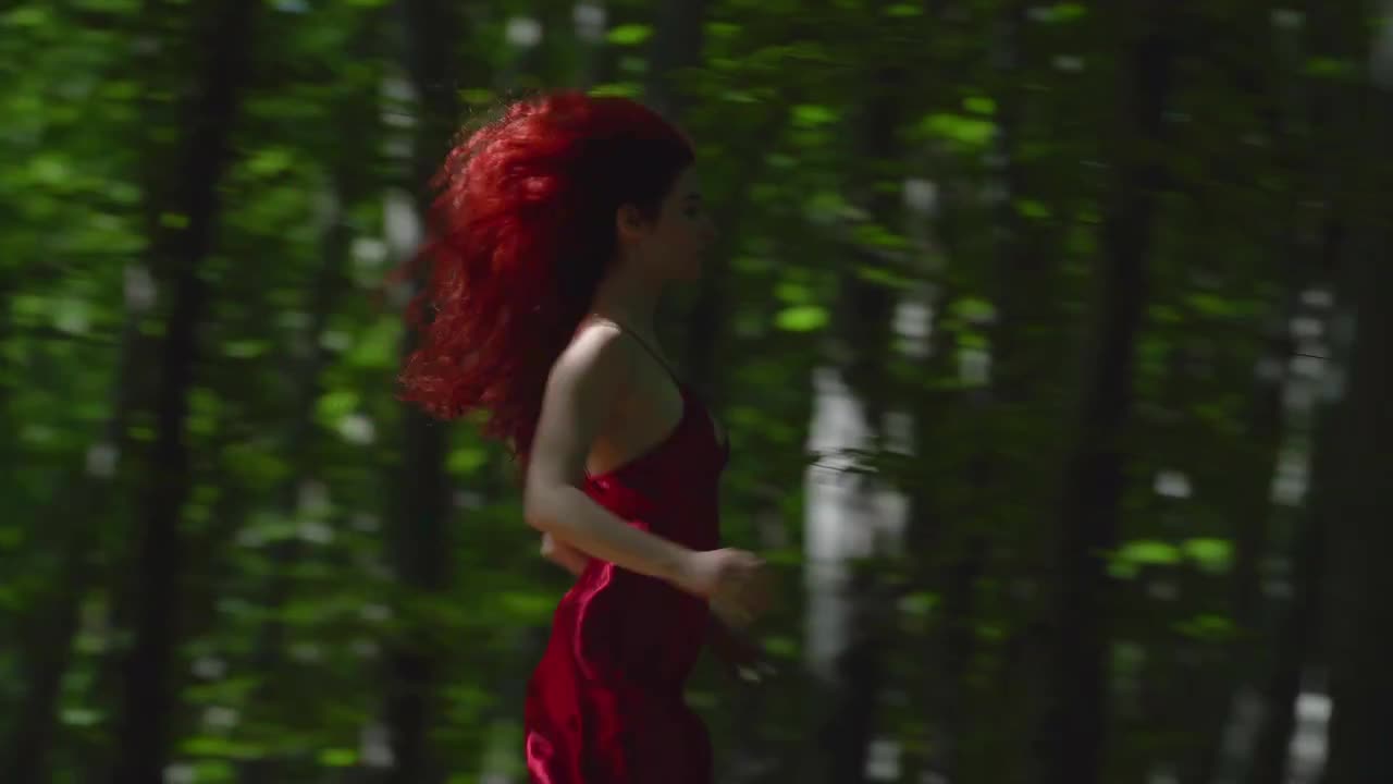 Redhead Girl Running Into The Woods Stock Video Motion Array