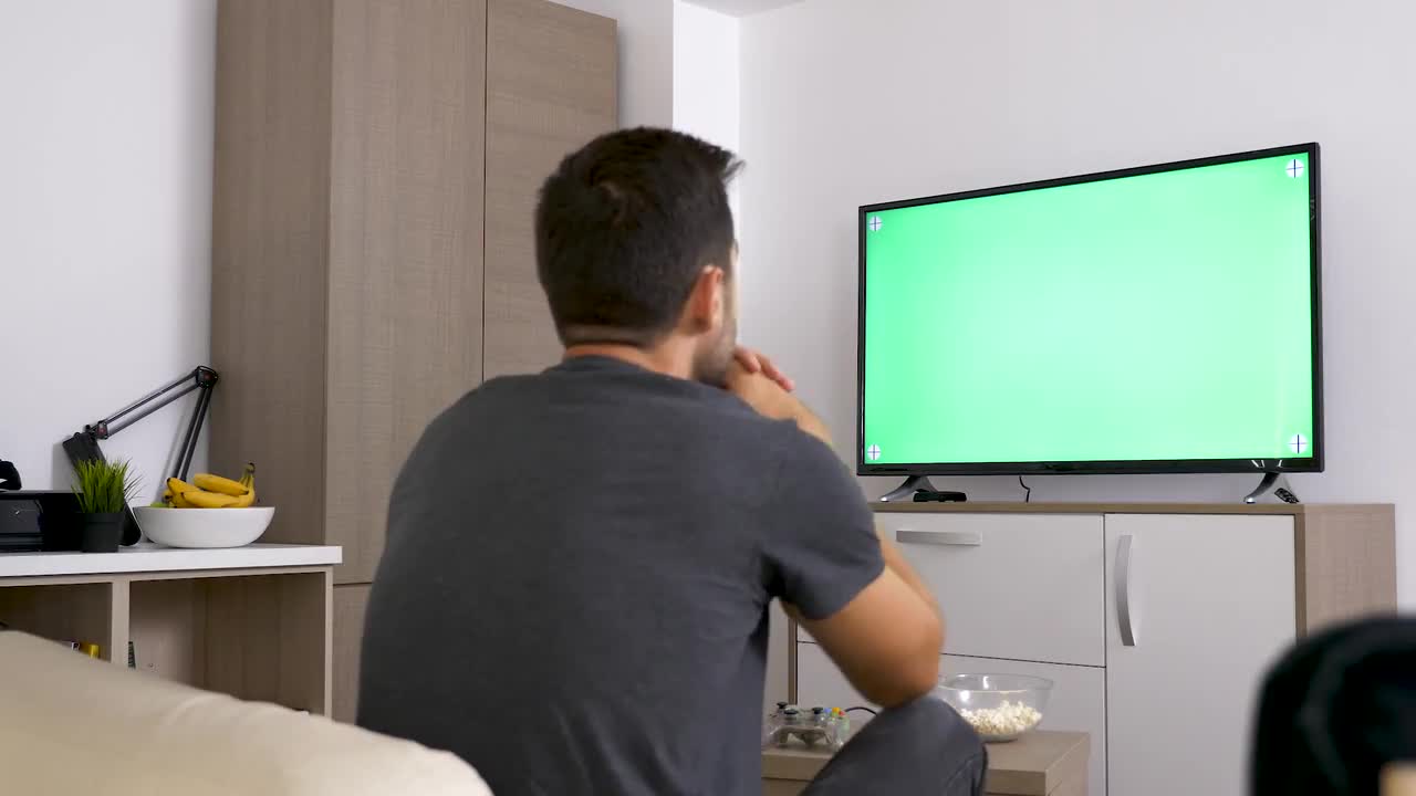 Watching TV With Green Screen Stock Video Motion Array