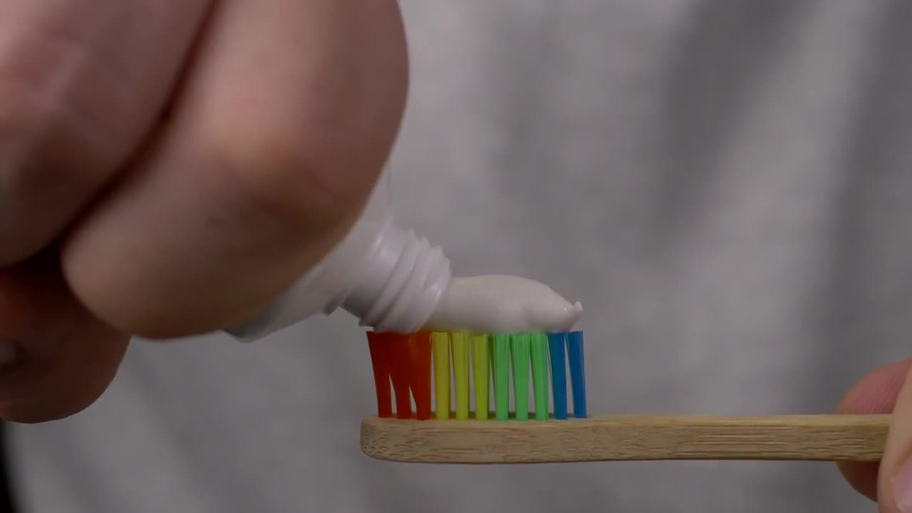 Applying Toothpaste On Toothbrush Stock Video Motion Array