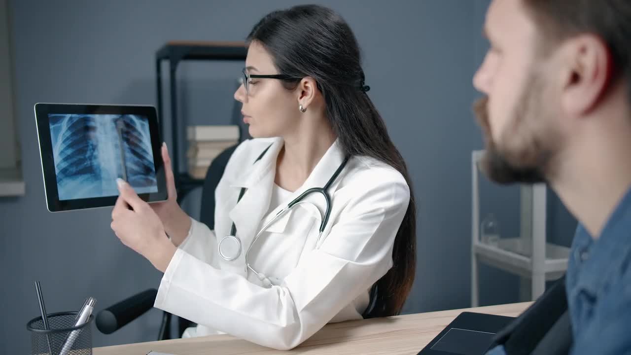 Doctor Shows Chest XRay Stock Video Motion Array