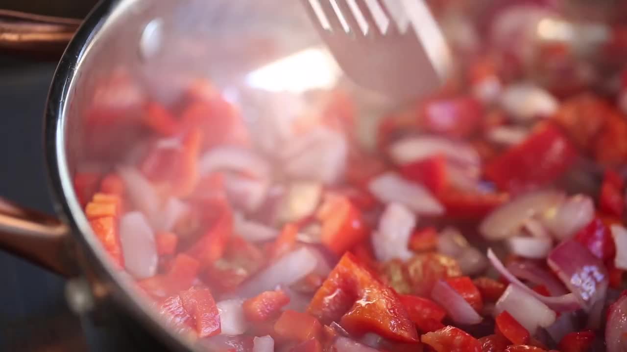 Frying Tomatoes And Onions Stock Video Motion Array
