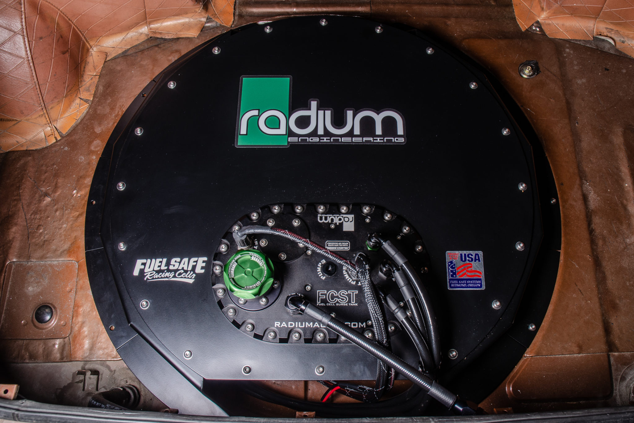 Radium Releases Spare Tire Fuel Cell Mounting Brackets! MotoIQ