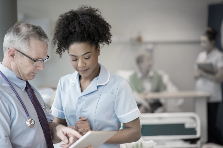 young nurse with doctor Moundridge Manor, Inc.