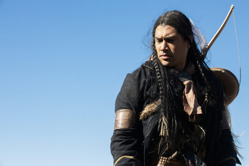 Martin Sensmeier as Sam in a scene from the Paramount+ original series 1883, Created and written by Taylor Sheridan. Photo Cr: Paramount+ © 2022 MTV Entertainment Studios. All Rights Reserved.