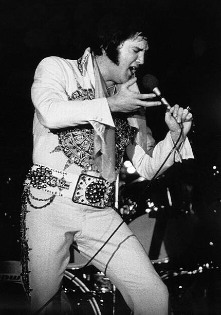 6/20/1977-Lincoln, NE- Elvis Presley, the King of Rock and Roll, belts out a song during a performance, here 6/20. Photo Credit: Getty Images