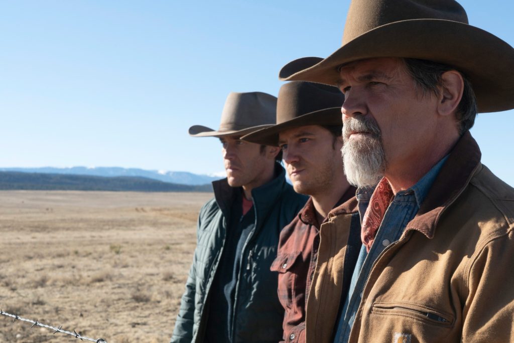 A scene from Outer Range with Perry Abbott, played by Tom Pelphrey, Rhett Abbott, played by Lewis Pullman, and Royal Abbott, played by Josh Brolin. (2022-)
