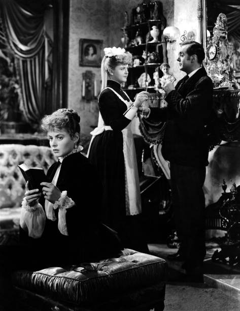Actress Angela Lansbury, Ingrid Bergman, Charles Boyer in a scene from the movie "Gaslight" (1944) Photo Credit: Metro-Goldwyn-Mayer/Getty Images